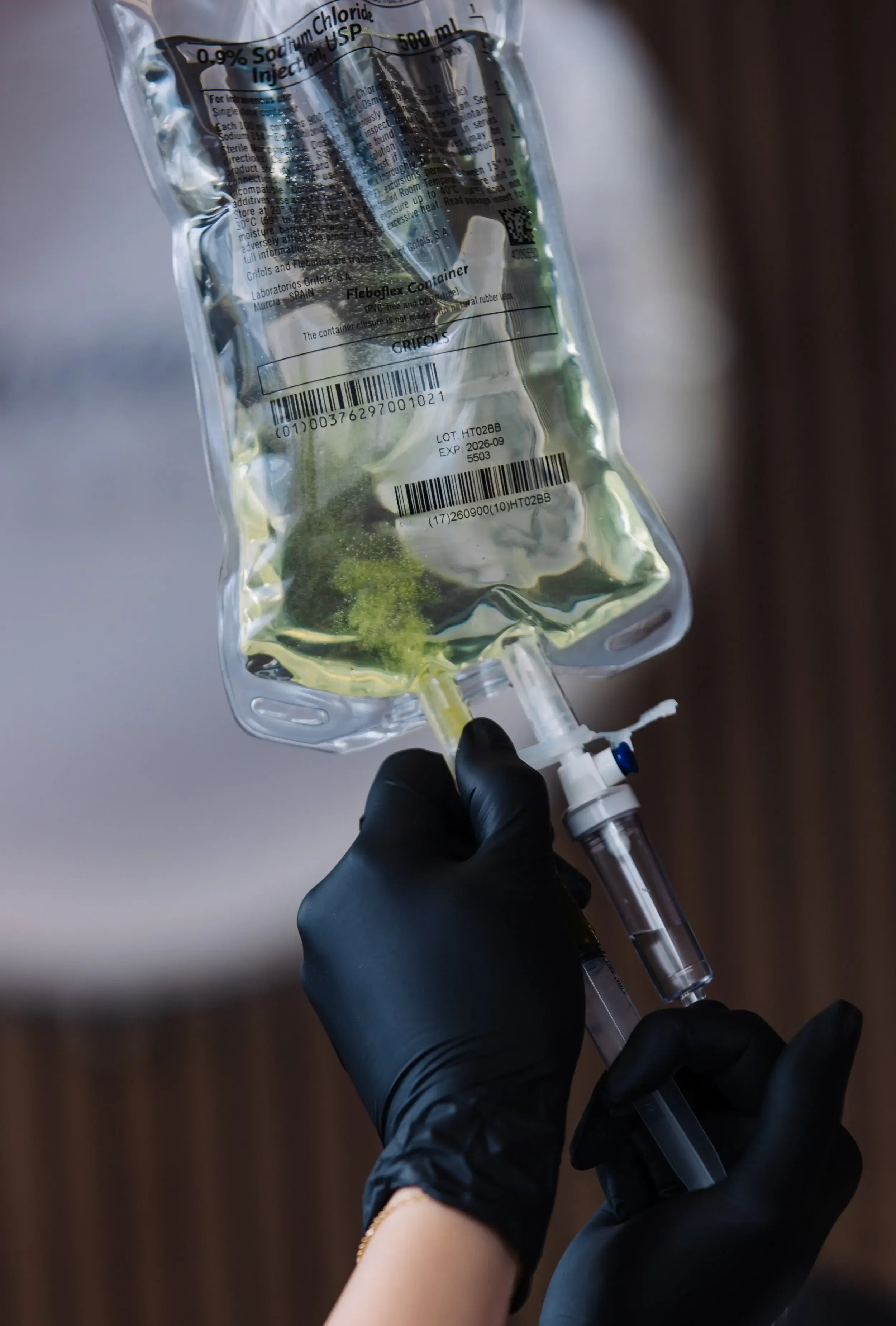 An IV bag as a nutrient mix disperses through the saline